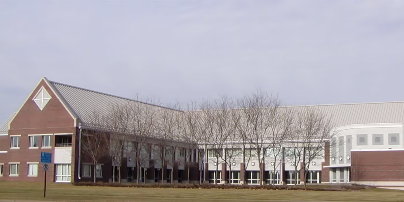 Brooklyn Park, Minnesota City Hall and civic center building exterior under a clear sky.