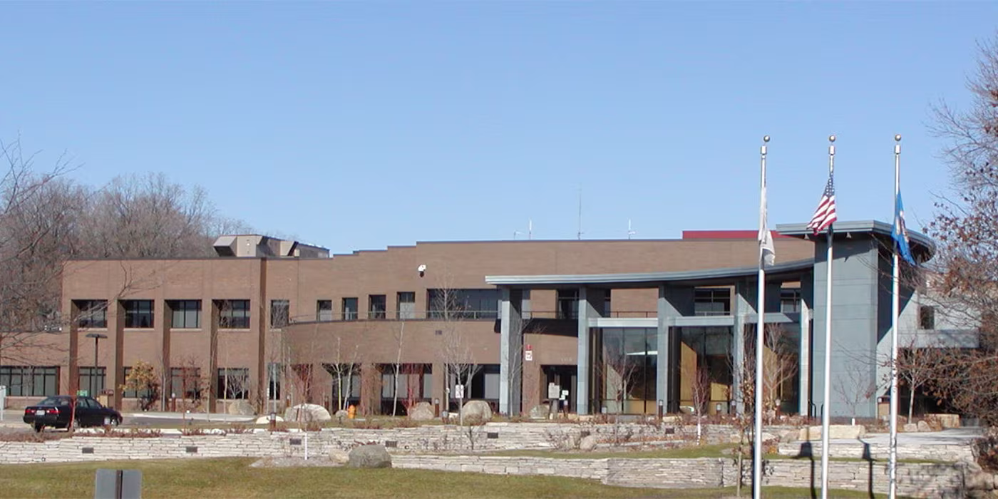 Plymouth, Minnesota City Hall building exterior with surrounding greenery.