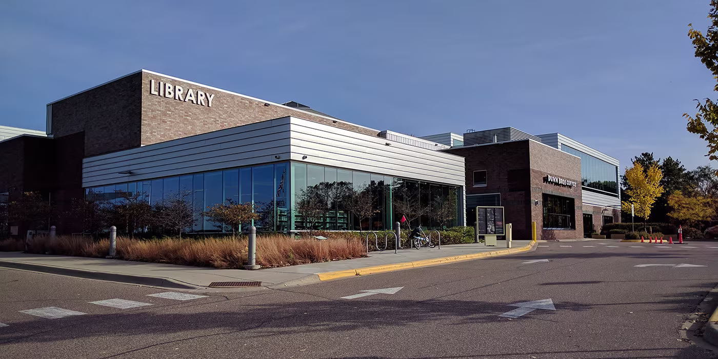 The Roseville, Minnesota Public Library building with surrounding landscaping.