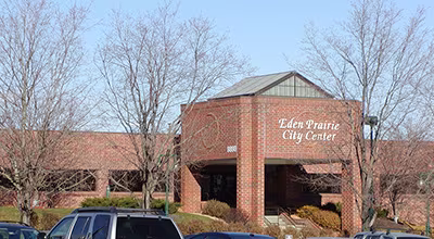 Exterior brick facade of the Eden Prairie City Center entrance with surrounding trees.