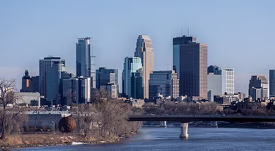 Aerial view of downtown Minneapolis, Minnesota with iconic architecture and the Mississippi River.