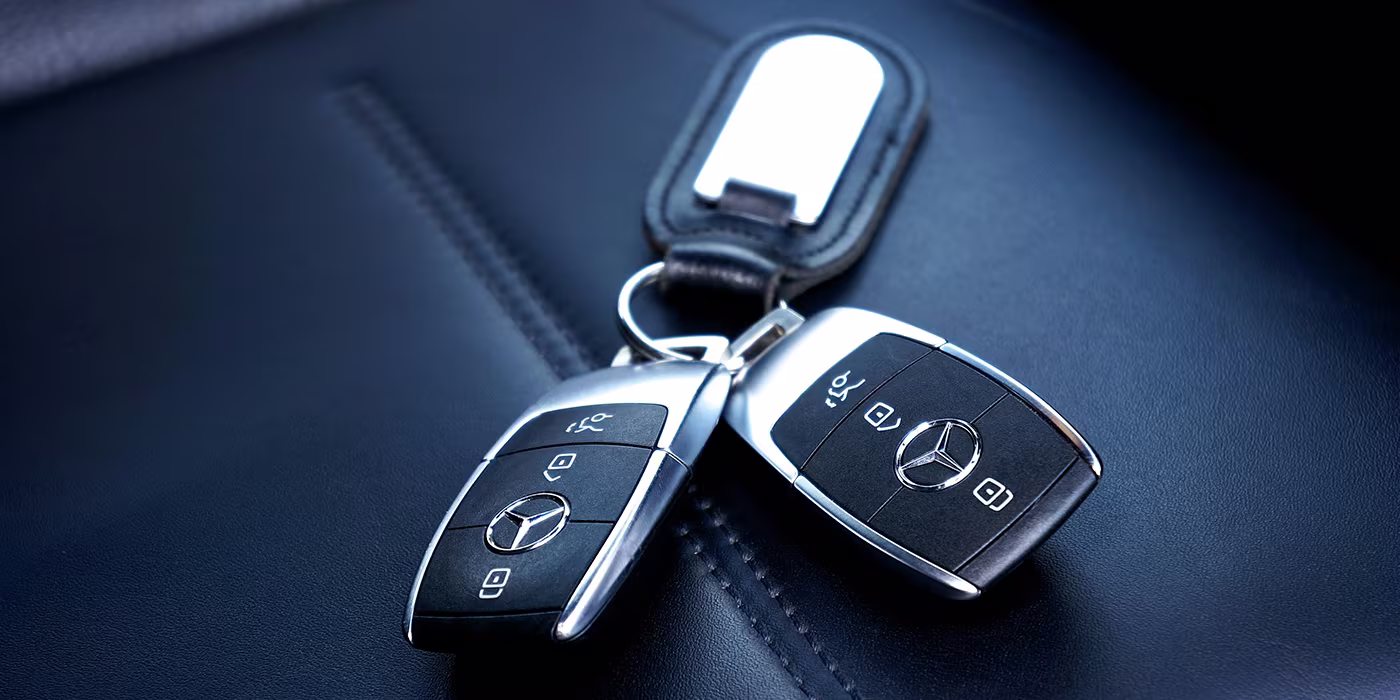 Locksmith cutting and programming a replacement car key on-site in Minneapolis