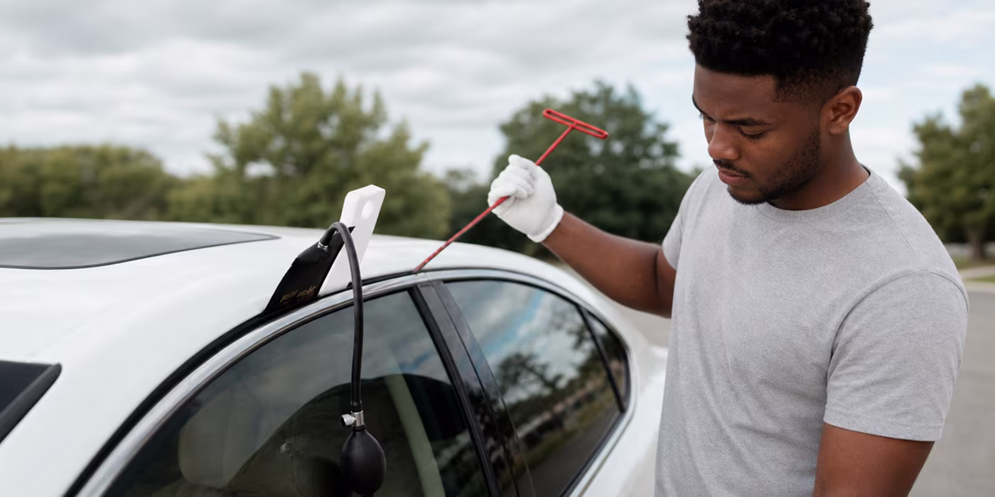 Mobile locksmith performing damage-free car lockout service in Minneapolis
