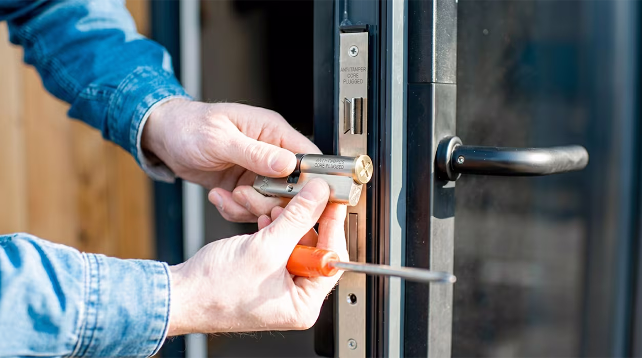 Locksmith rekeying commercial office locks in Minneapolis