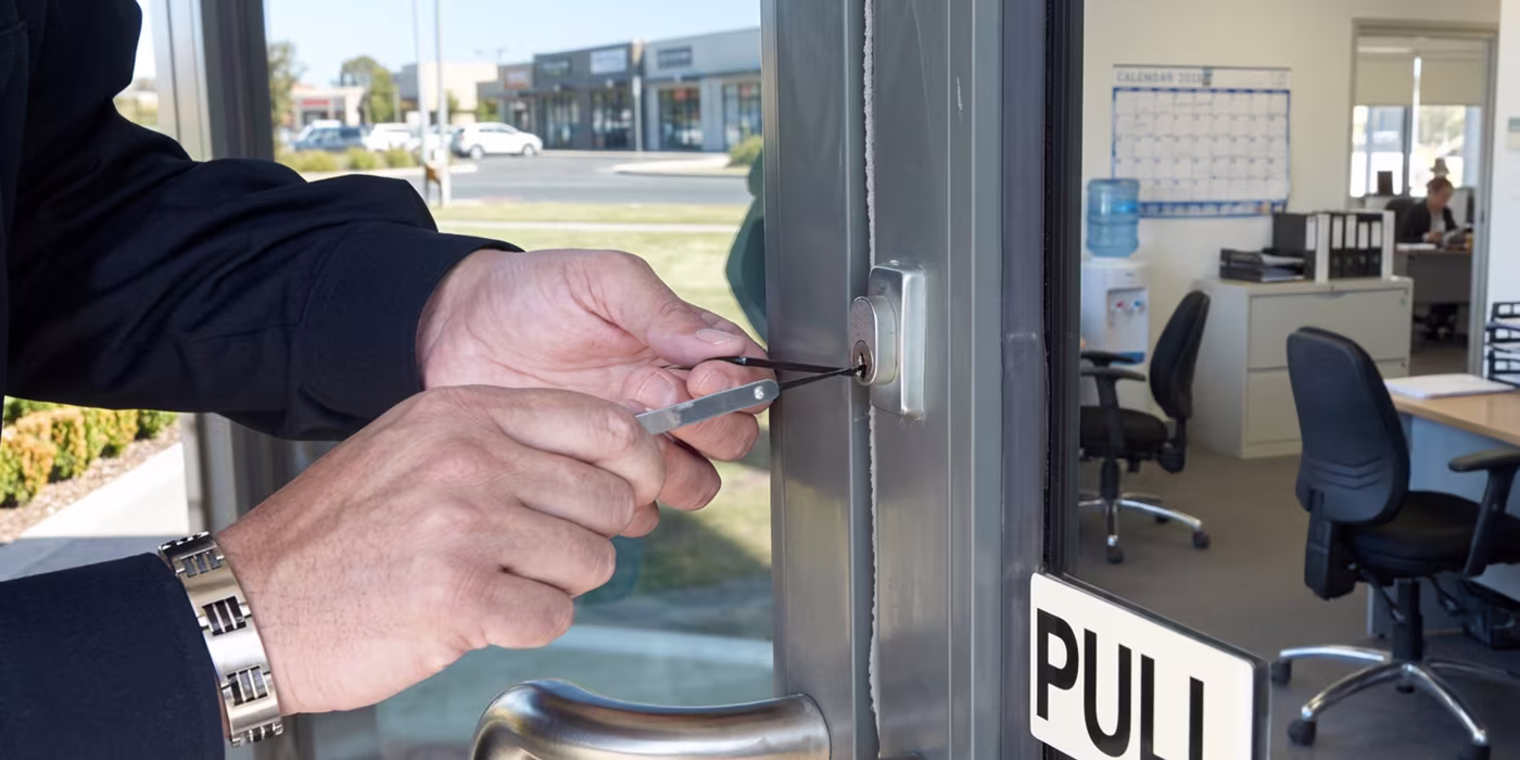 Commercial locksmith unlocking a business entrance in Minneapolis