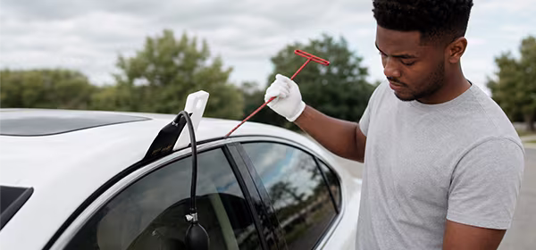 Car lockout service technician unlocking a vehicle in Minneapolis